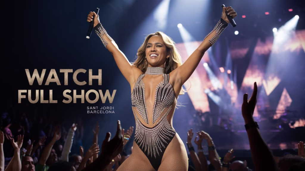 Jennifer Lopez performing live at Sant Jordi Club during her 2025 Up All Night tour in Barcelona, wearing a glittering bodysuit with stage lights behind her