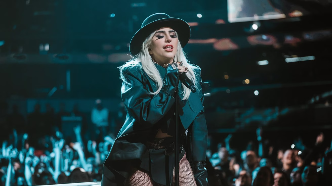“Lady Gaga performing live at Madison Square Garden during Mayhem Ball 2025, crowd cheering, dramatic stage lighting.”